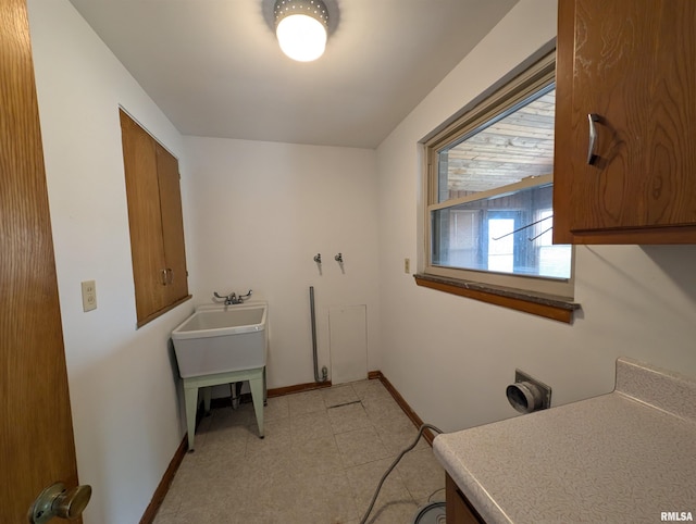 3720 Saint Michael Ave, Peoria, IL 61615 - laundry room featuring baseboards