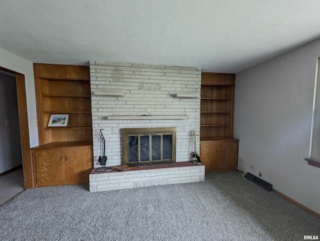 3720 Saint Michael Ave, Peoria, IL 61615 - unfurnished living room with a fireplace, baseboards, built in shelves, and carpet