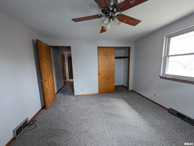 3720 Saint Michael Ave, Peoria, IL 61615 - unfurnished bedroom featuring visible vents, baseboards, a closet, ceiling fan, and carpet