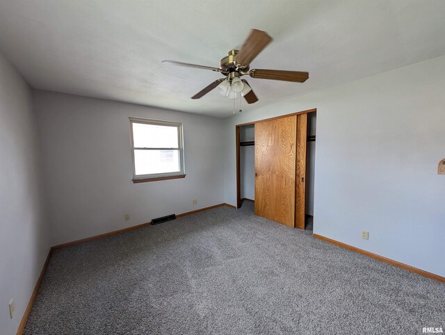3720 Saint Michael Ave, Peoria, IL 61615 - unfurnished bedroom featuring a closet, a ceiling fan, visible vents, carpet floors, and baseboards