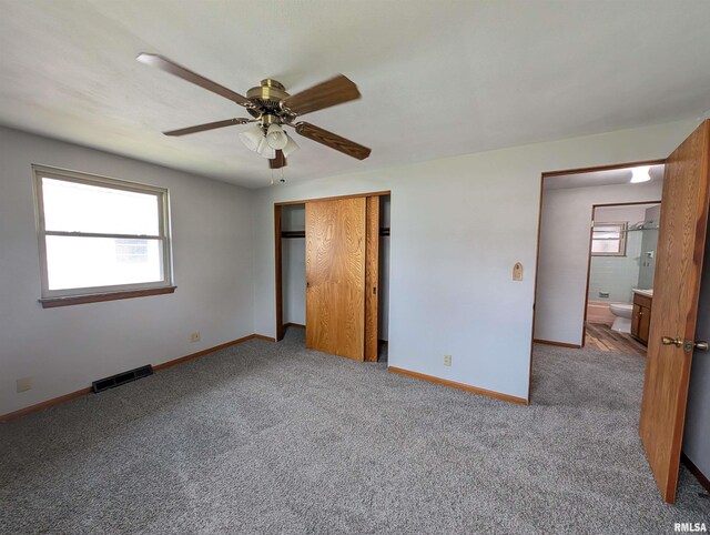 3720 Saint Michael Ave, Peoria, IL 61615 - unfurnished bedroom with a closet, carpet, visible vents, and baseboards