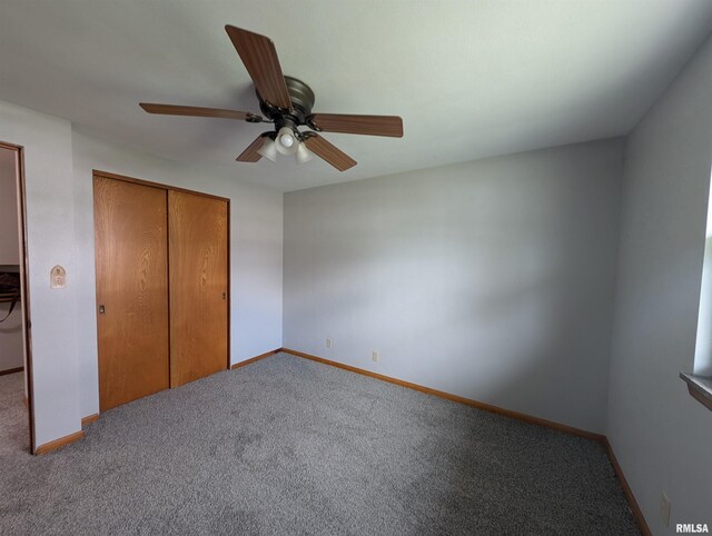 3720 Saint Michael Ave, Peoria, IL 61615 - unfurnished bedroom featuring a closet, baseboards, a ceiling fan, and carpet