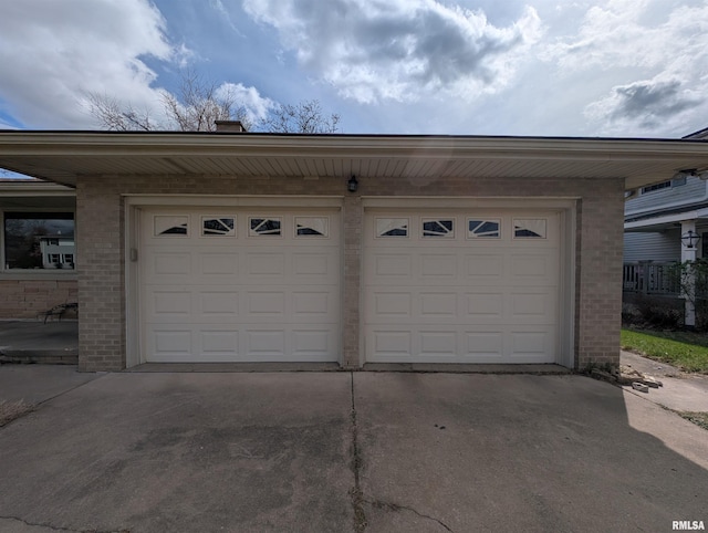 3720 Saint Michael Ave, Peoria, IL 61615 - garage featuring concrete driveway