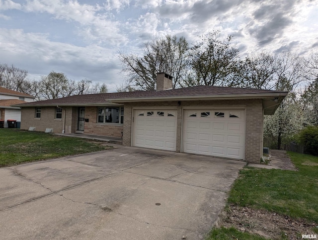3720 Saint Michael Ave, Peoria, IL 61615 - single story home featuring an attached garage, a chimney, driveway, and brick siding