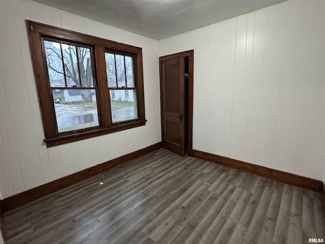 1017 W Brons Ave, Peoria, IL 61604 - unfurnished room with baseboards and dark wood finished floors