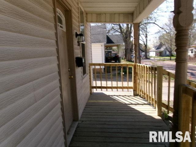wooden terrace featuring a porch