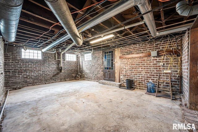 below grade area featuring brick wall
