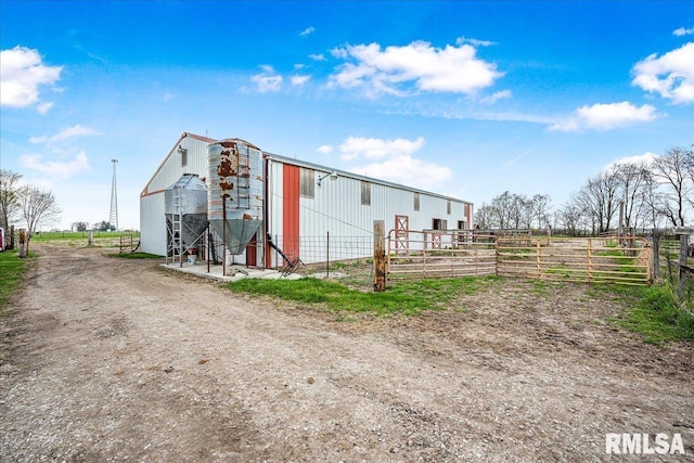 view of outbuilding with an outbuilding and fence