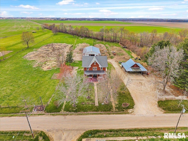 birds eye view of property featuring a rural view