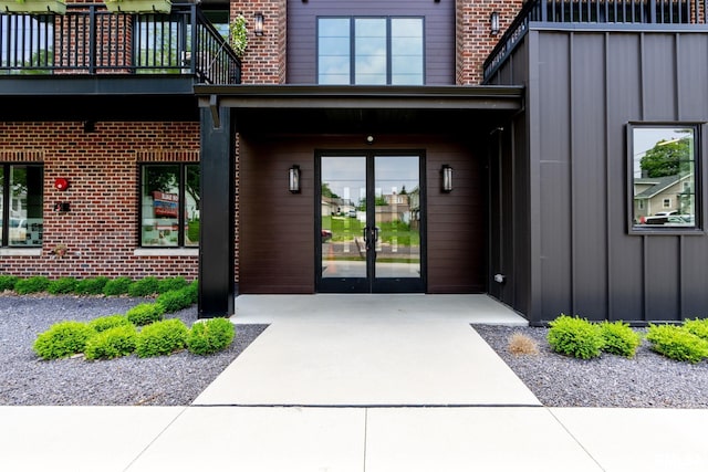 1310 E Samuel Ave, Peoria Heights, IL 61616 - property entrance with brick siding, french doors, and board and batten siding