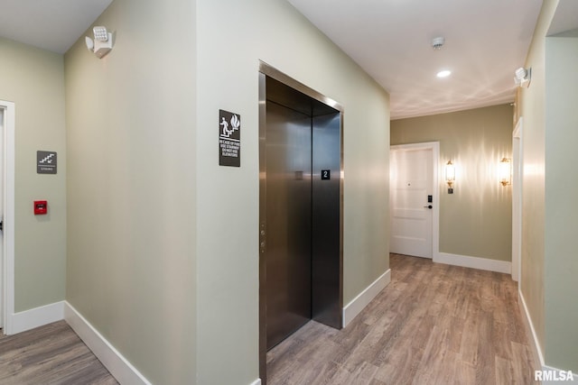 1310 E Samuel Ave, Peoria Heights, IL 61616 - hallway with recessed lighting, elevator, baseboards, and wood finished floors