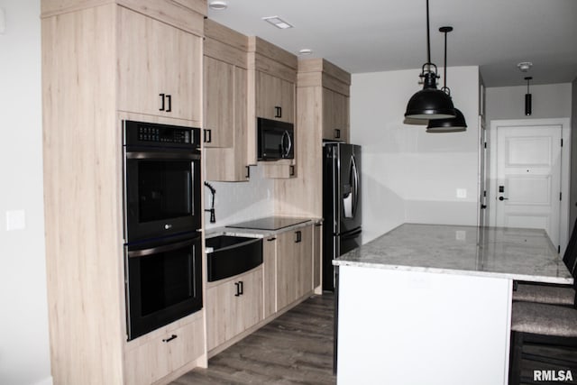 1310 E Samuel Ave, Peoria Heights, IL 61616 - kitchen featuring a center island, dark wood-style flooring, light brown cabinetry, black appliances, and light stone countertops