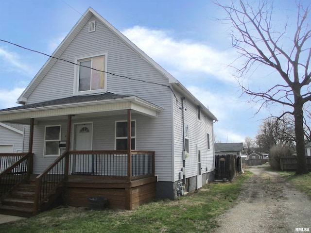 bungalow featuring driveway and a porch
