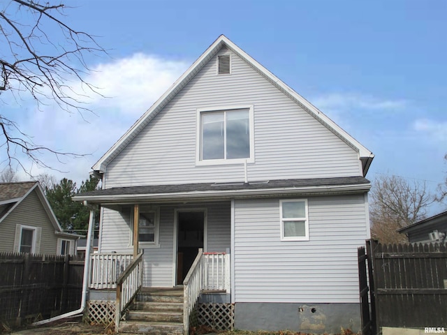 view of front of home featuring fence and covered porch