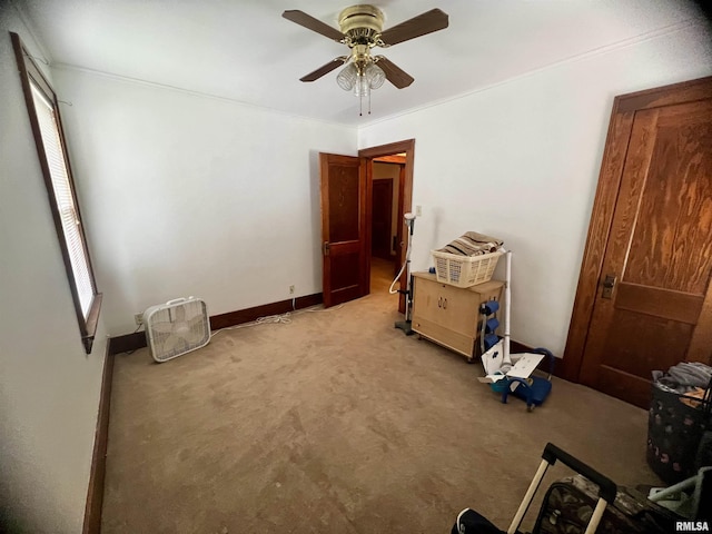 1837 Baird Ave, Galesburg, IL 61401 - unfurnished bedroom featuring light carpet, a ceiling fan, and baseboards