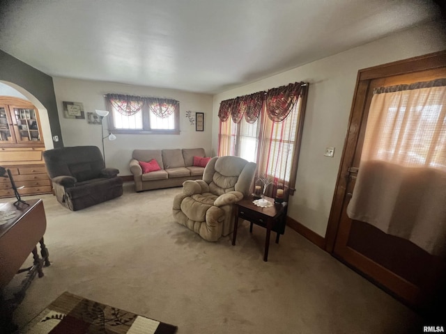 1837 Baird Ave, Galesburg, IL 61401 - carpeted living area featuring baseboards and arched walkways
