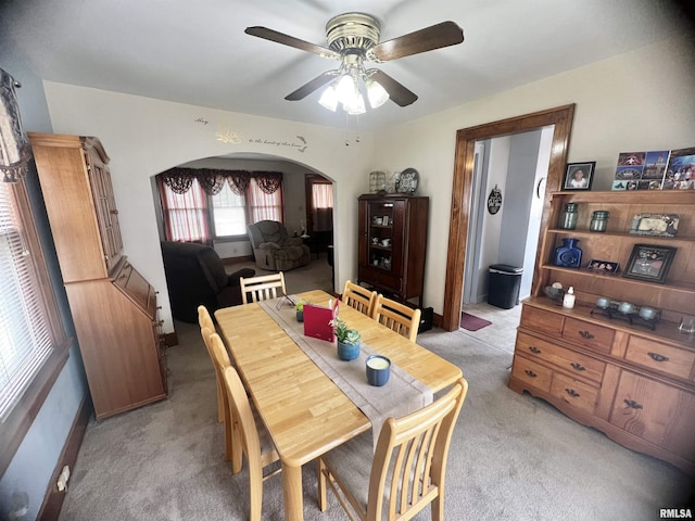 1837 Baird Ave, Galesburg, IL 61401 - dining area featuring arched walkways, light carpet, and ceiling fan