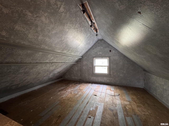 bonus room featuring hardwood / wood-style floors and vaulted ceiling