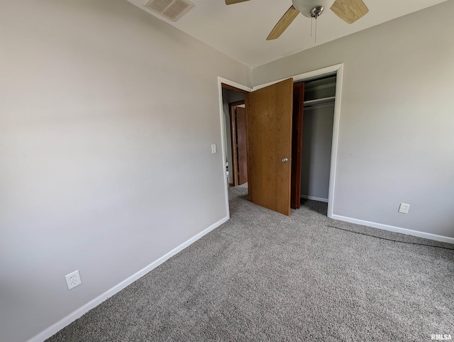 unfurnished bedroom featuring visible vents, a closet, baseboards, carpet flooring, and ceiling fan
