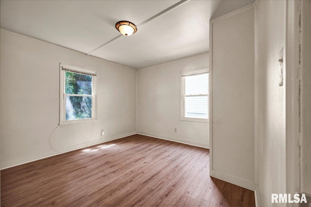 301 E Ellington Dr, Peoria, IL 61603 - empty room featuring wood finished floors and ornamental molding