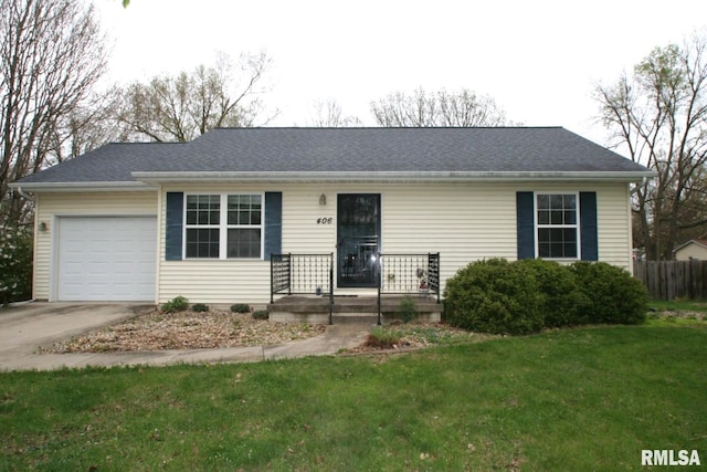 406 N Minier Ave, Minier, IL 61759 - ranch-style house featuring driveway, a front yard, and a garage