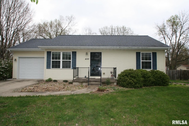 406 N Minier Ave, Minier, IL 61759 - ranch-style house with fence, a front yard, concrete driveway, and an attached garage