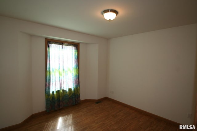 406 N Minier Ave, Minier, IL 61759 - unfurnished room with wood finished floors and baseboards