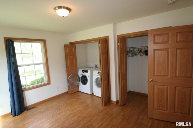 406 N Minier Ave, Minier, IL 61759 - laundry area featuring washing machine and clothes dryer, light wood-style flooring, laundry area, and baseboards
