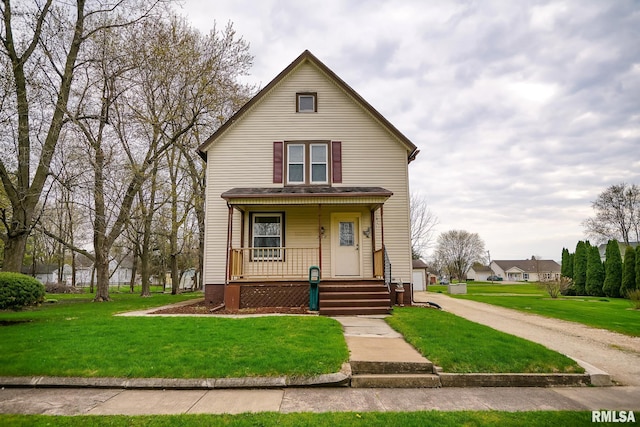 238 E Prospect St, Galesburg, IL 61401 - view of front of house with covered porch, a front yard, and a garage
