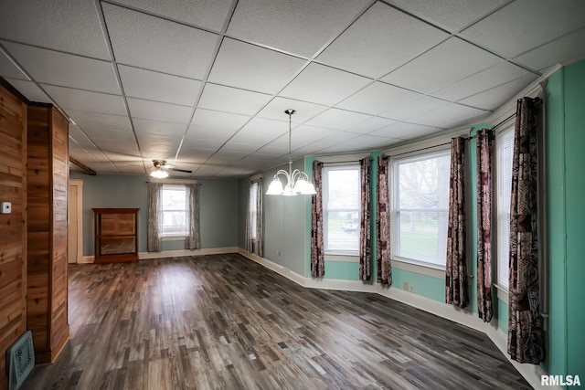 238 E Prospect St, Galesburg, IL 61401 - unfurnished dining area featuring a chandelier, wood finished floors, a drop ceiling, and baseboards