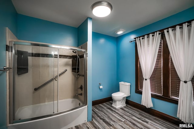 238 E Prospect St, Galesburg, IL 61401 - bathroom with wood finished floors, combined bath / shower with glass door, toilet, and baseboards