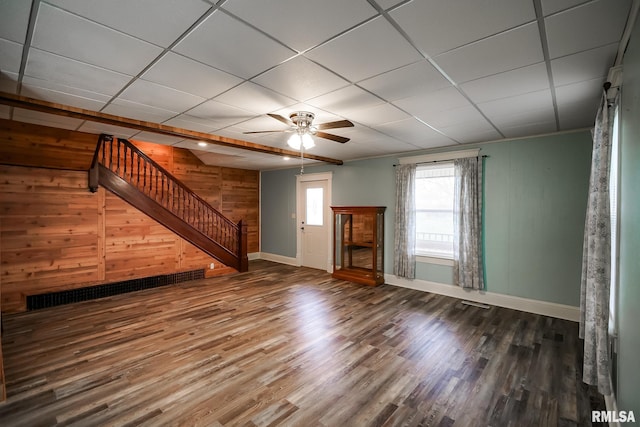 238 E Prospect St, Galesburg, IL 61401 - unfurnished living room with wooden walls, wood finished floors, stairs, and baseboards