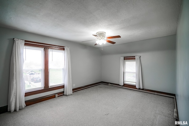 238 E Prospect St, Galesburg, IL 61401 - carpeted empty room featuring a textured ceiling, a ceiling fan, and baseboards