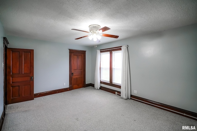 238 E Prospect St, Galesburg, IL 61401 - carpeted spare room featuring a textured ceiling, a ceiling fan, and baseboards