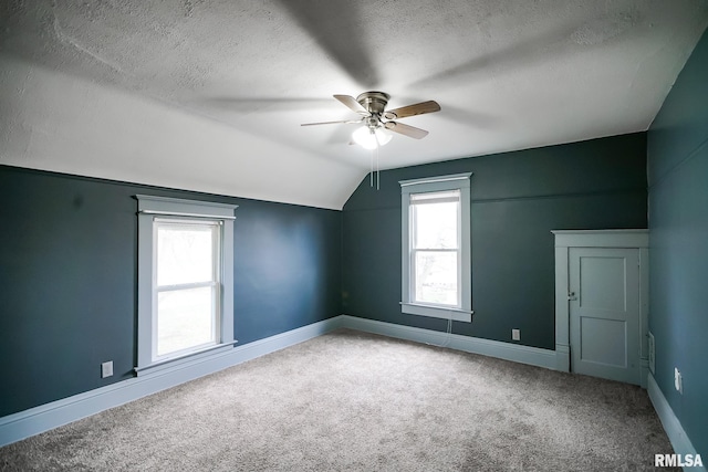 238 E Prospect St, Galesburg, IL 61401 - bonus room featuring a textured ceiling, baseboards, carpet, lofted ceiling, and ceiling fan