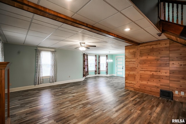 238 E Prospect St, Galesburg, IL 61401 - unfurnished living room featuring visible vents, baseboards, wood finished floors, and a drop ceiling