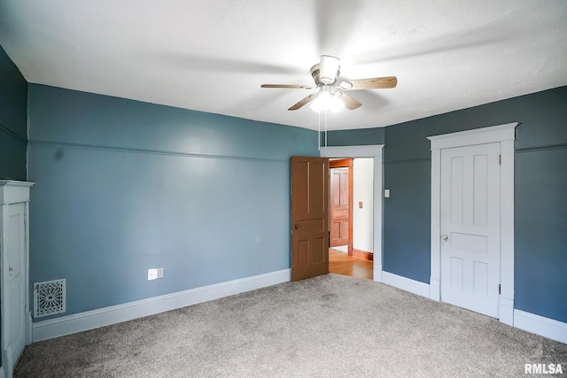 238 E Prospect St, Galesburg, IL 61401 - unfurnished bedroom featuring a ceiling fan, a closet, baseboards, carpet flooring, and visible vents