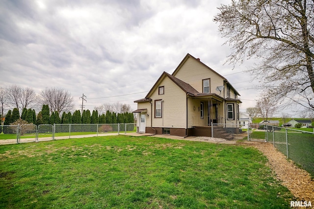 238 E Prospect St, Galesburg, IL 61401 - view of side of home with a gate, a yard, and a fenced backyard
