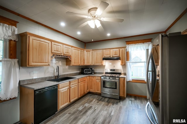 238 E Prospect St, Galesburg, IL 61401 - kitchen featuring a wealth of natural light, under cabinet range hood, stainless steel appliances, and a sink