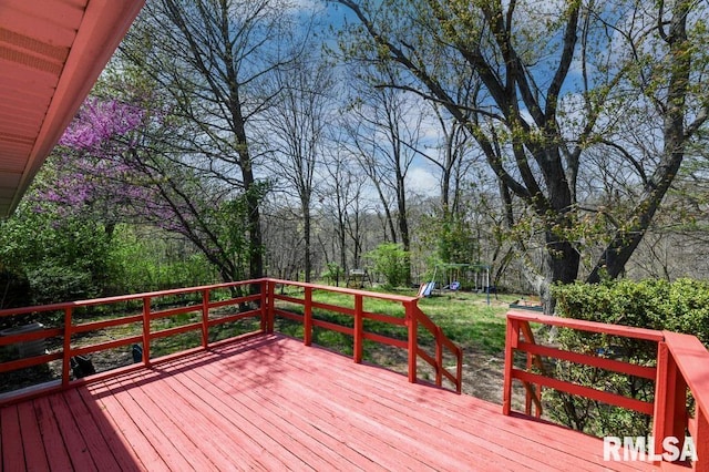 deck featuring a yard and a playground