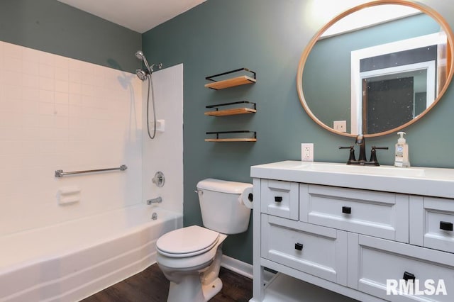 bathroom featuring toilet, baseboards, shower / bath combination, wood finished floors, and vanity