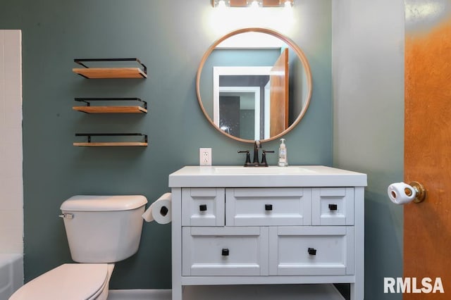 full bath featuring a washtub, toilet, walk in shower, and vanity
