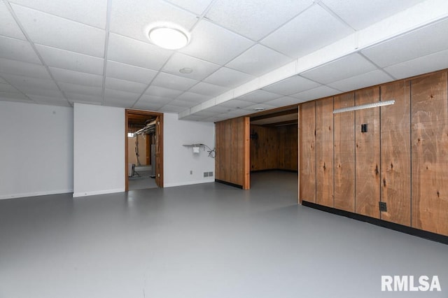 finished basement with baseboards and visible vents