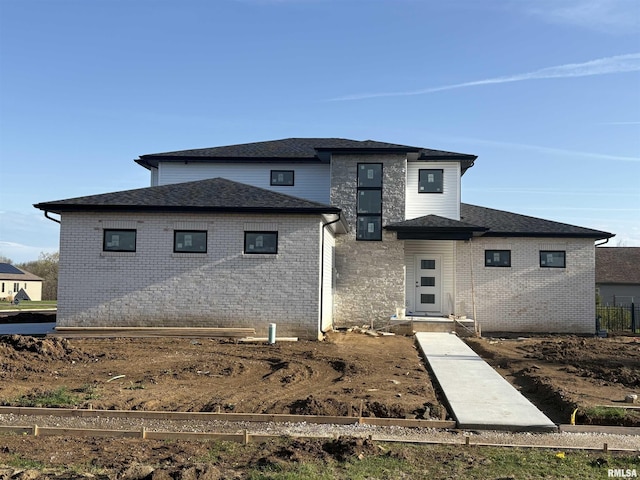 112 Shannon Hills Dr, Washington, IL 61571 - rear view of house featuring brick siding and a shingled roof