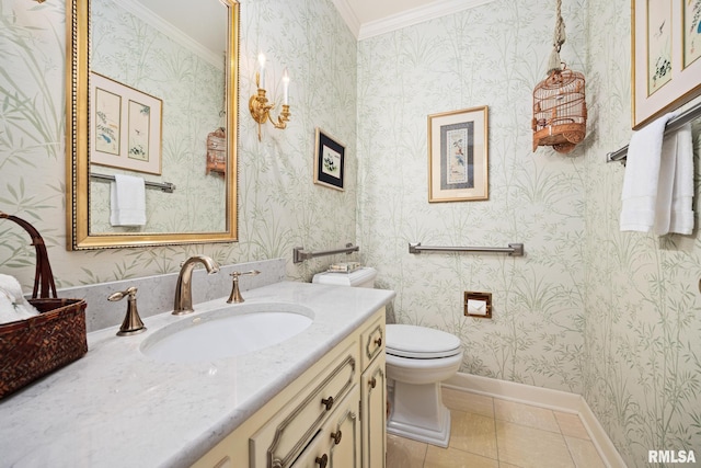 bathroom with toilet, tile patterned floors, vanity, and ornamental molding