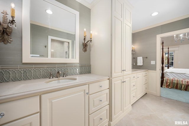 full bathroom with ensuite bathroom, vanity, recessed lighting, and crown molding