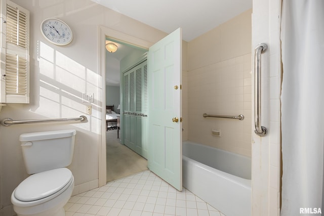 bathroom with tile patterned flooring, a bathtub, a shower, and toilet