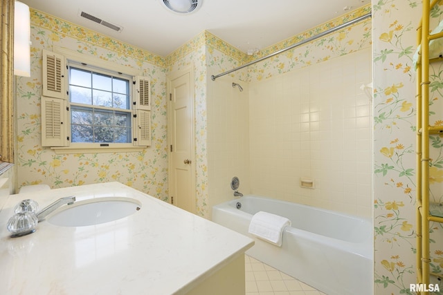 full bath featuring tile patterned floors, vanity, visible vents, and bathtub / shower combination