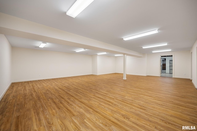 interior space with light wood-style flooring and baseboards