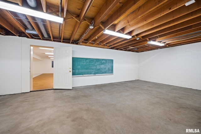 basement featuring concrete block wall